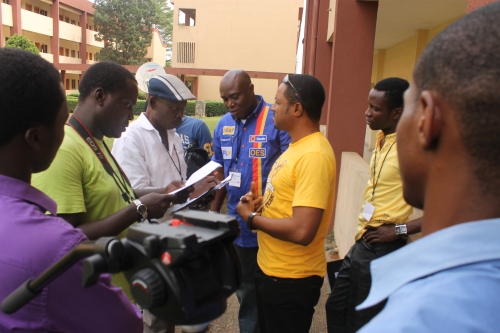 Collaborative exercise underway between screenwriter, director, and cinematographer participants. 