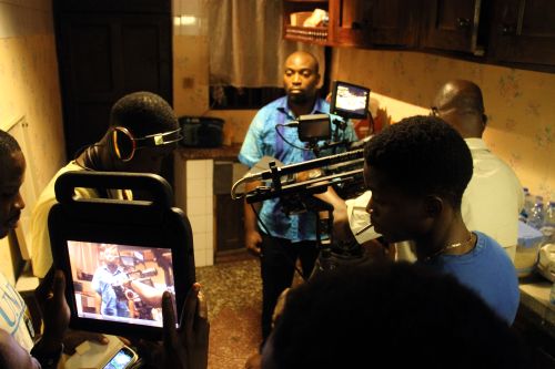 Actor Seun Akindele in the kitchen, the weight of the world on his character's shoulders. 